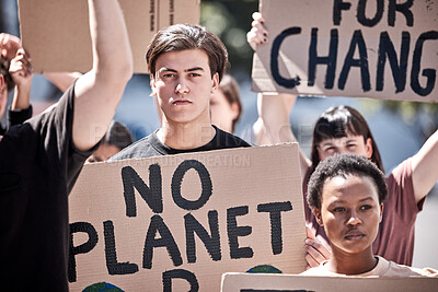 Buy stock photo Man, posters and protest in outdoor portrait, saving planet and rally for climate change in society. Male person, public movement and community for voice, march and riot global problem or cardboard