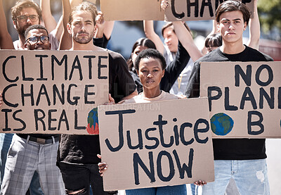 Buy stock photo Shot of a group of young people protesting climate change
