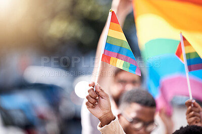 Buy stock photo Closeup, hands and LGBTQ flag with people, protest and community with human right, gay and lesbian. Zoom, queer and group with rainbow symbol, sexuality and bisexual with freedom, pride and happiness