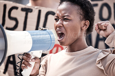 Buy stock photo Frustrated black woman, megaphone and protest with community for human rights, equality or change in city street. Angry African, female person or activist screaming on loudspeaker in riot or rally