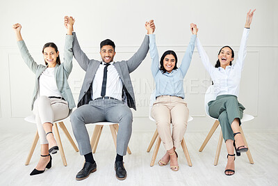 Buy stock photo Portrait of a group of businesspeople people cheering while sitting down against a grey background