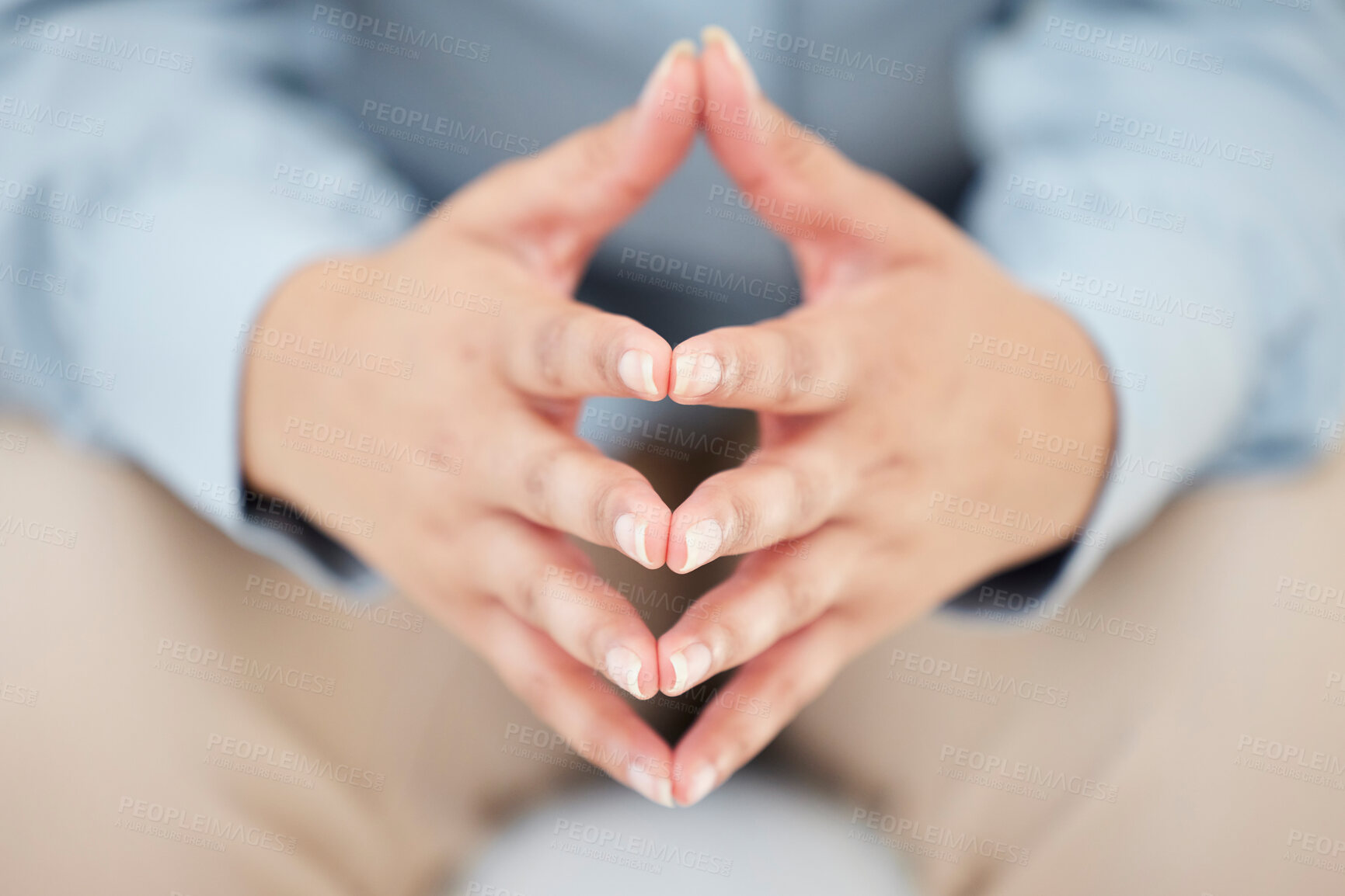 Buy stock photo Closeup shot of an unrecognizable's hands while sitting nervously in the studio