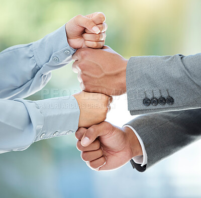 Buy stock photo Cropped shot of two unrecognizable businesspeople standing with their fists stacked in the office