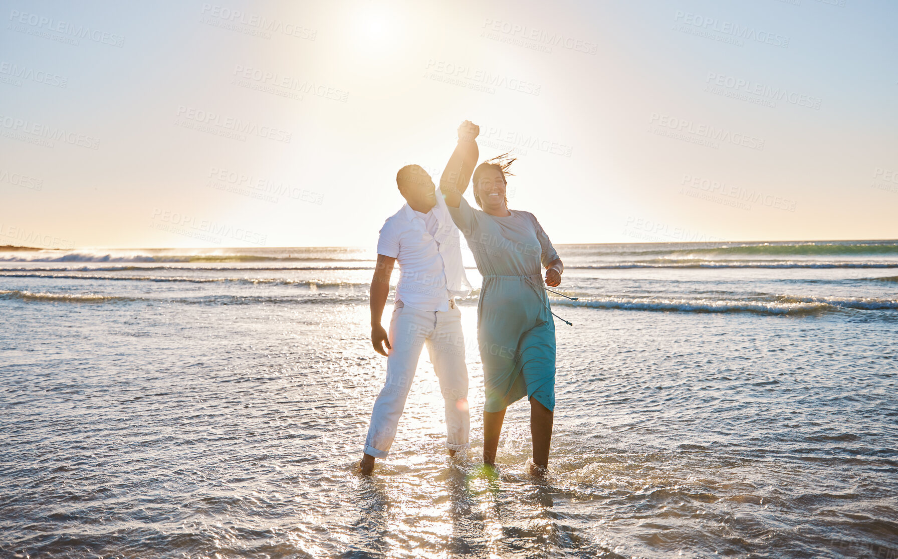 Buy stock photo Water, romantic or happy couple at beach to dance for love on vacation, valentines day or holiday. Tropical break, outdoor and people bonding together at sea or ocean for honeymoon trip on island