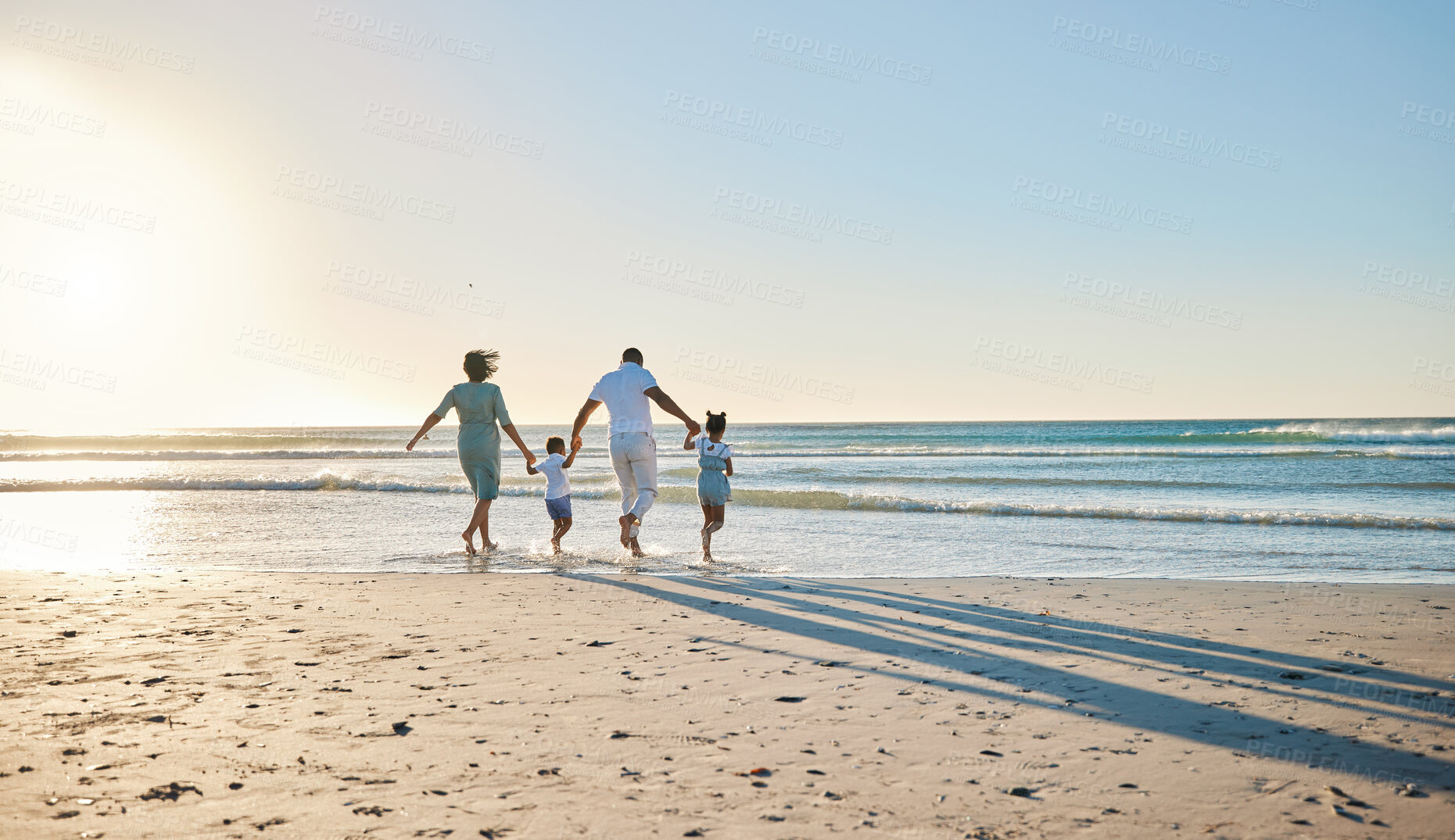 Buy stock photo Family, beach walking and holding hands with mother, father and kids by the ocean on holiday. Vacation, love and parent care with mockup in summer outdoor with mom, dad and children by sea having fun