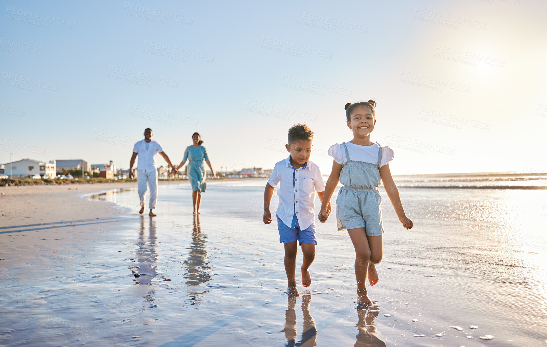 Buy stock photo Parents, siblings or children at beach for walking, holiday or travel on break with boy, girl or family. Excited, mom or father with kids at sea on vacation together for wellness or nature to relax