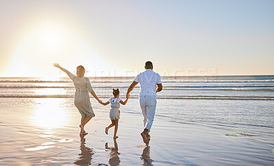 Buy stock photo Running, waves and parents with child at beach for bonding on summer holiday, vacation and weekend. Morning, family and mom, dad and girl holding hands for fun, adventure and relax outdoors in nature