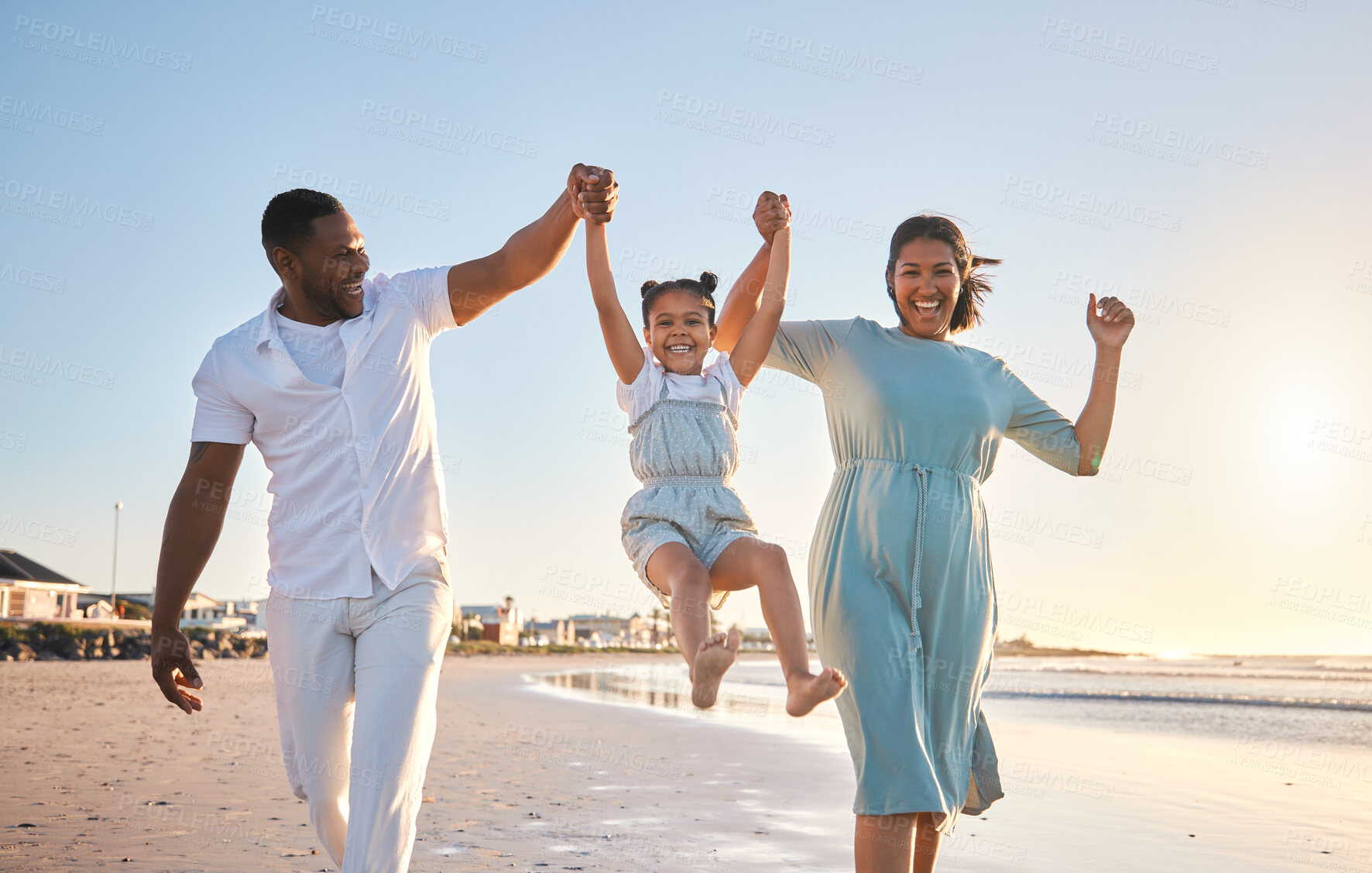 Buy stock photo Beach, parents and child in portrait for swing, playful and bonding together on vacation holiday. Family, mother and father with girl for security, connection and air game with happiness in ocean