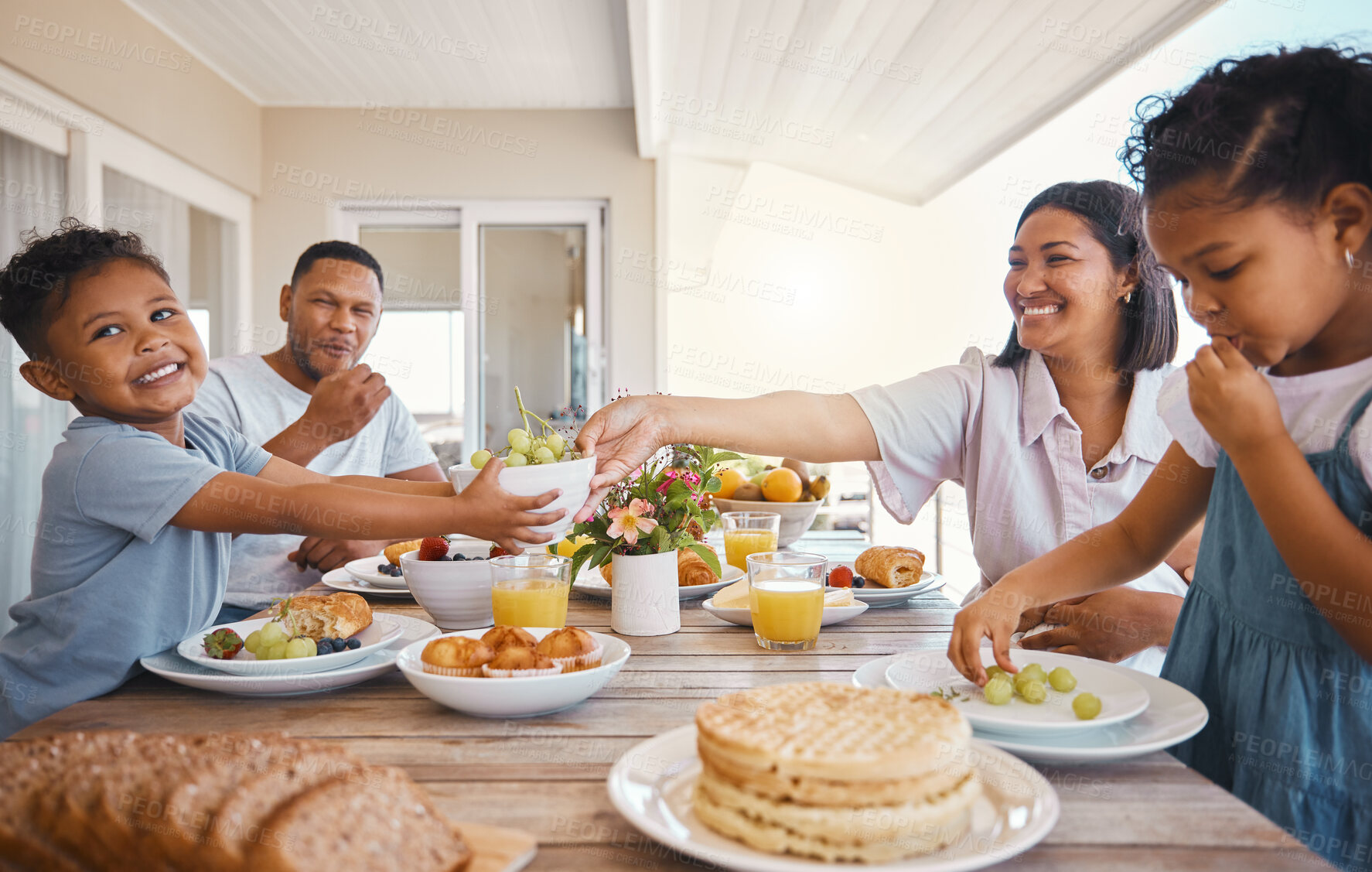 Buy stock photo Parents, children and food for lunch outdoor in home with bonding, healthy meal or laughing together. Family, people and breakfast on patio with serving, nutrition or eating for relax or relationship