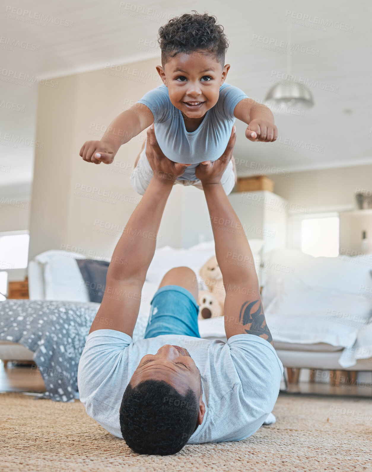 Buy stock photo Home, father and child with flying for playing, connection and bonding with childhood game on weekend. Family, papa and boy on carpet for airplane, security and parenting with happiness in lounge