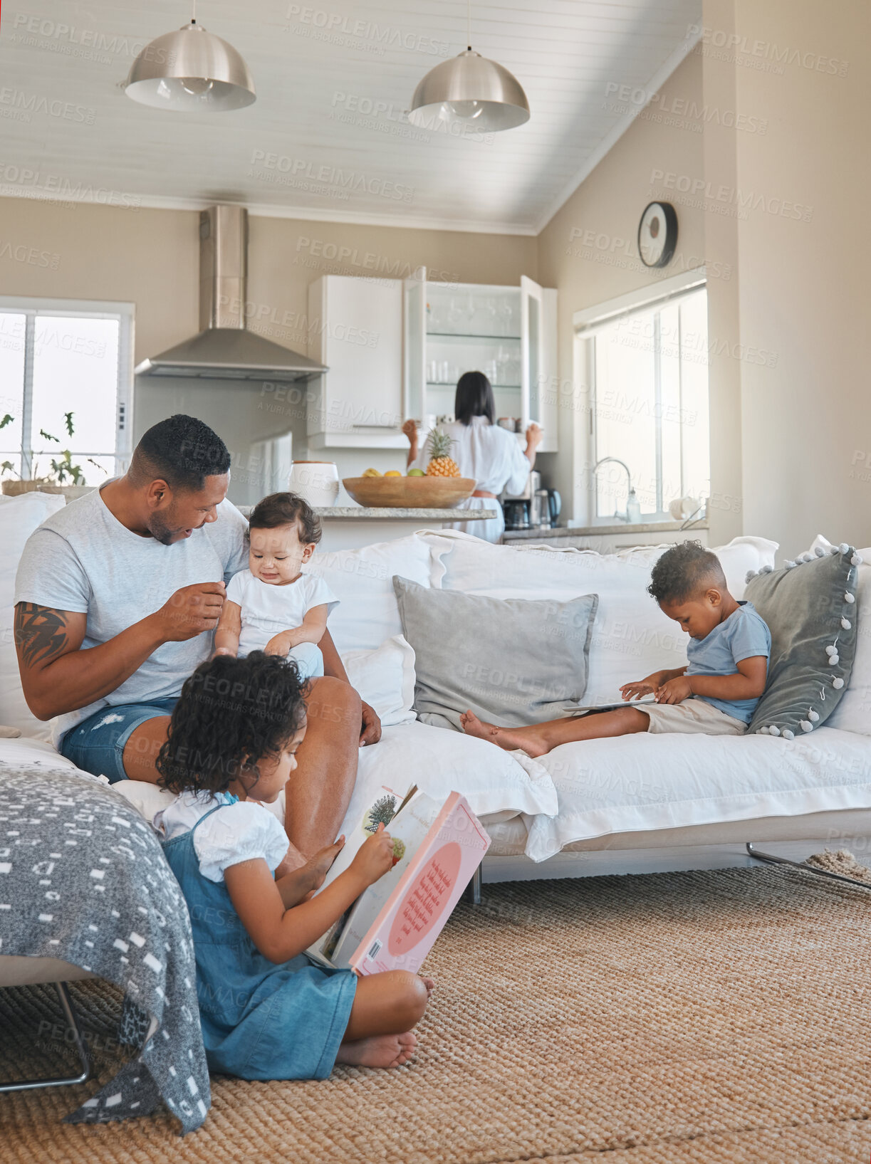 Buy stock photo Family, bonding and parents with children in living room for love, care and support on weekend. Kids, relax and father with baby on sofa at home for development, growth and enjoyment in morning