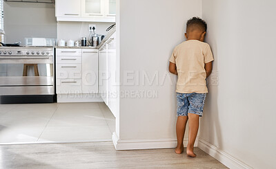 Buy stock photo Shot of a little boy standing in the corner at home