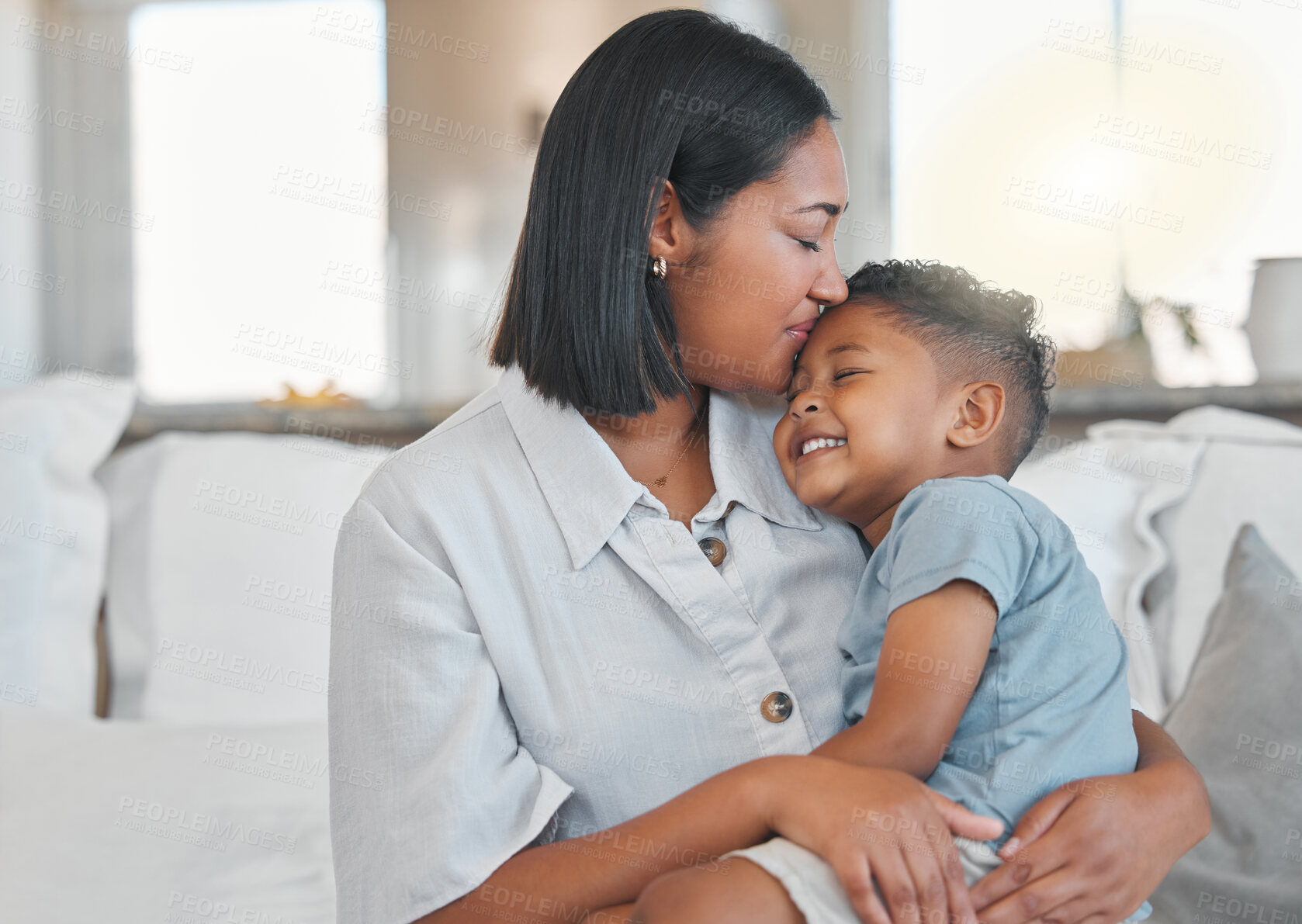 Buy stock photo Mother, child and hug with kiss on sofa with bonding, connection or affection with smile in home. Happy family, woman or boy kid on couch with embrace, love and relationship for security or support