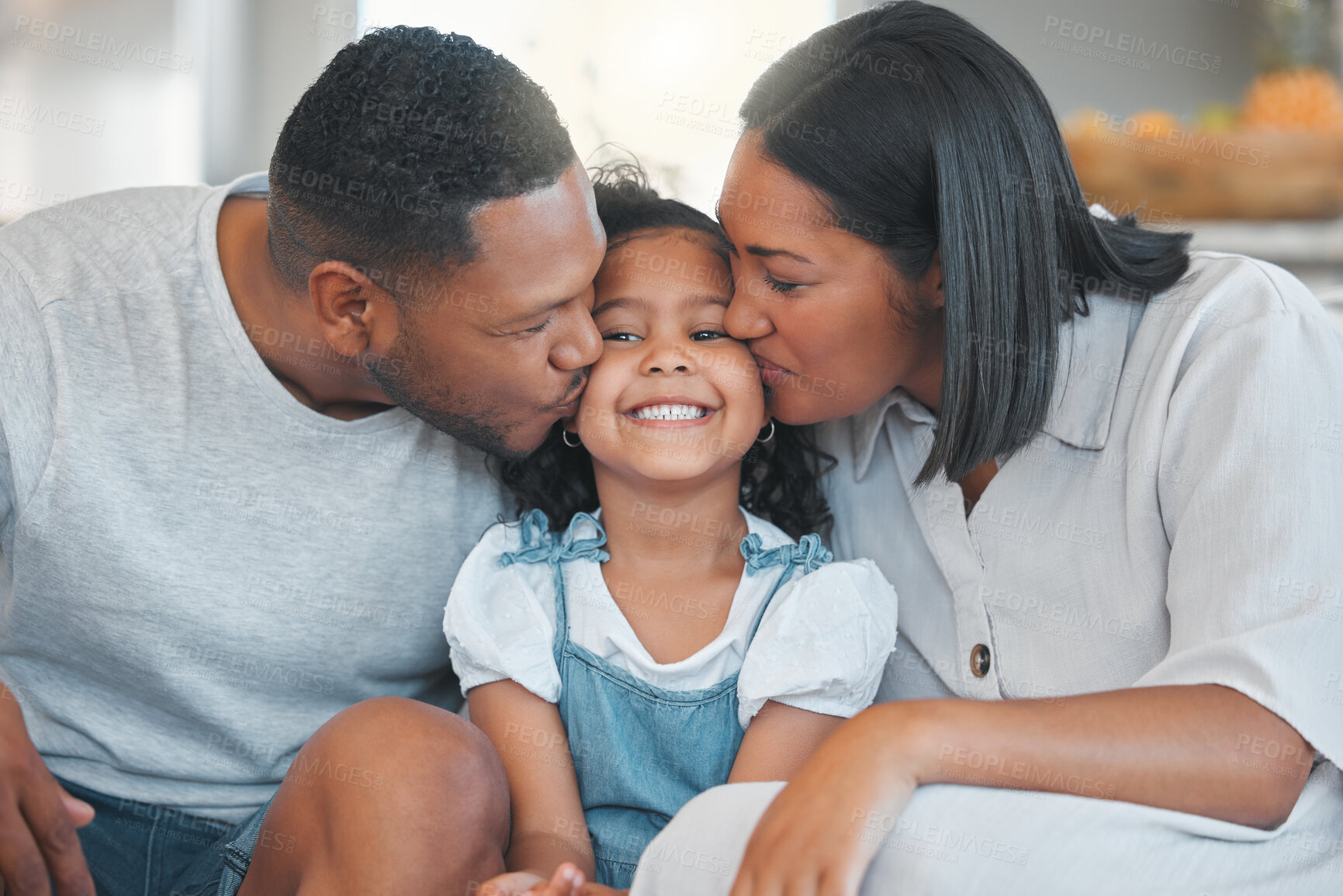 Buy stock photo Parents, child and smile with kiss on sofa with bonding, connection or affection with support in home. Happy family, people and girl on couch with embrace, love and relationship for security or care