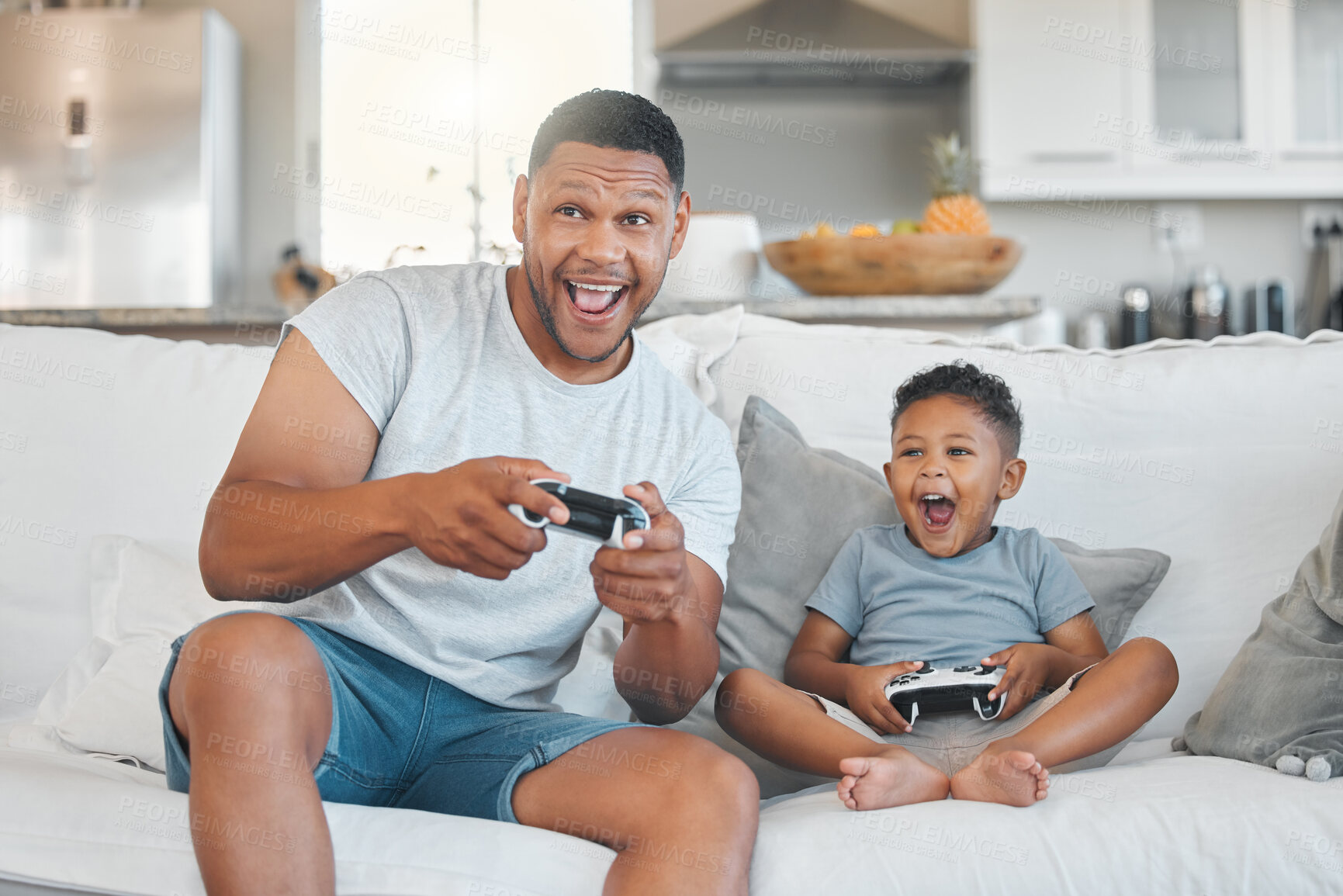 Buy stock photo Father, son and video game with controller on sofa, happy and excited for contest, playful and bonding in house. Man, dad and child with smile, connection or press button for challenge in family home