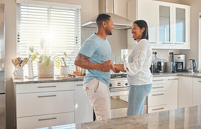 Buy stock photo Love, smile and couple dance in kitchen for romantic relationship, support or bonding. Music, man and woman moving in home to celebrate anniversary, marriage or holding hands for commitment together