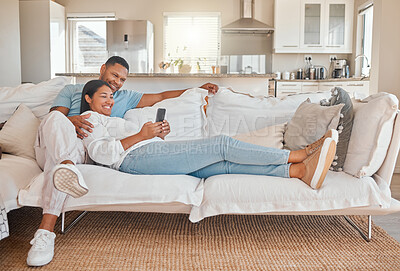 Buy stock photo Couple, couch and happy with smartphone in living room on internet, entertainment and social media. People, relationship and smile or laughing with funny videos, memes or website subscription at home