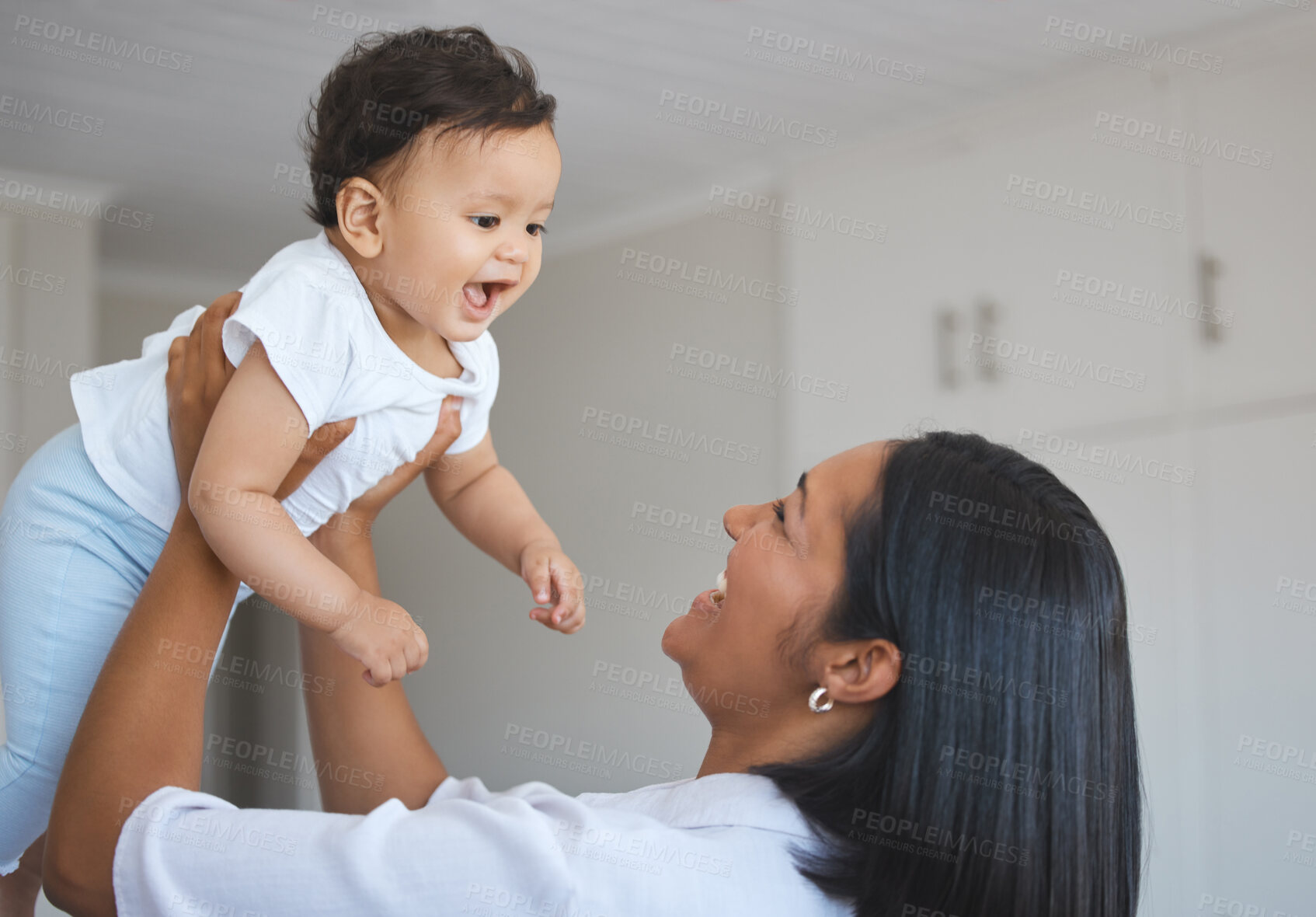 Buy stock photo Bonding, mom and baby in morning, playing and love for child, family and together with newborn or young. Care, happy and motherhood for woman, smile and affection for infant, parent or mother in home