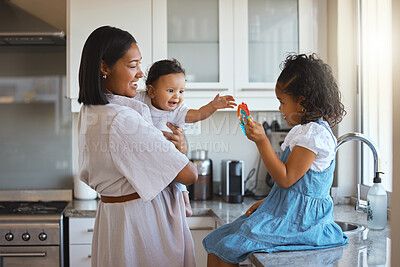 Buy stock photo Love, smile and toy with family in kitchen of home together for bonding or child development. Growth, having fun or playing with mother, daughter and baby in apartment for learning or motor skill