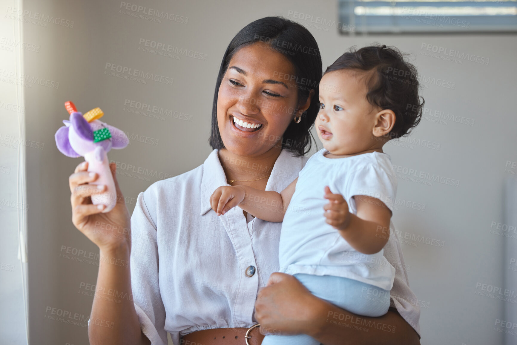 Buy stock photo Bonding, mom and baby in morning, toy and love for child, family and together with infant and young. Care, happy and motherhood for woman, playful and smile for affection, parent and mother in home