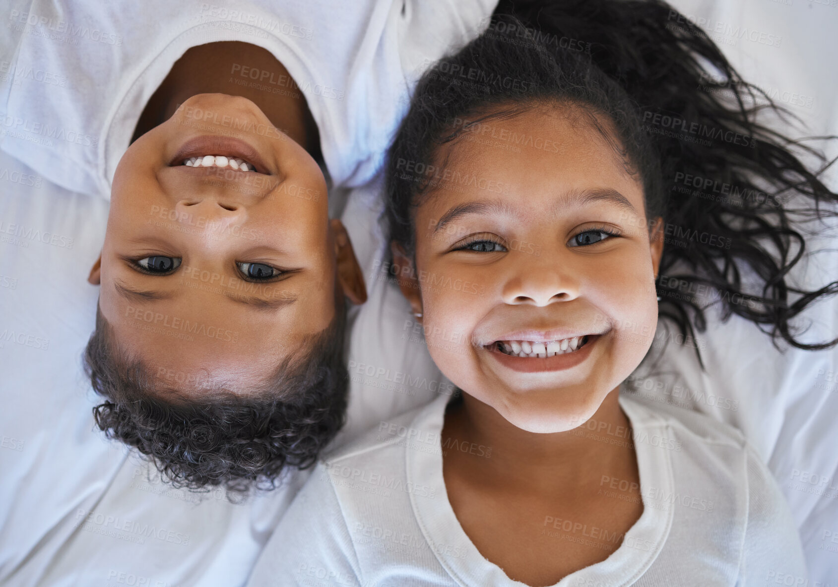 Buy stock photo Smile, relax and portrait of children in bedroom for wake up, morning and happiness. Bonding, love and care with above of young siblings in family home for cute relationship, youth and peace together