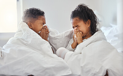 Buy stock photo Shot of a brother and sister blowing their nose in bed