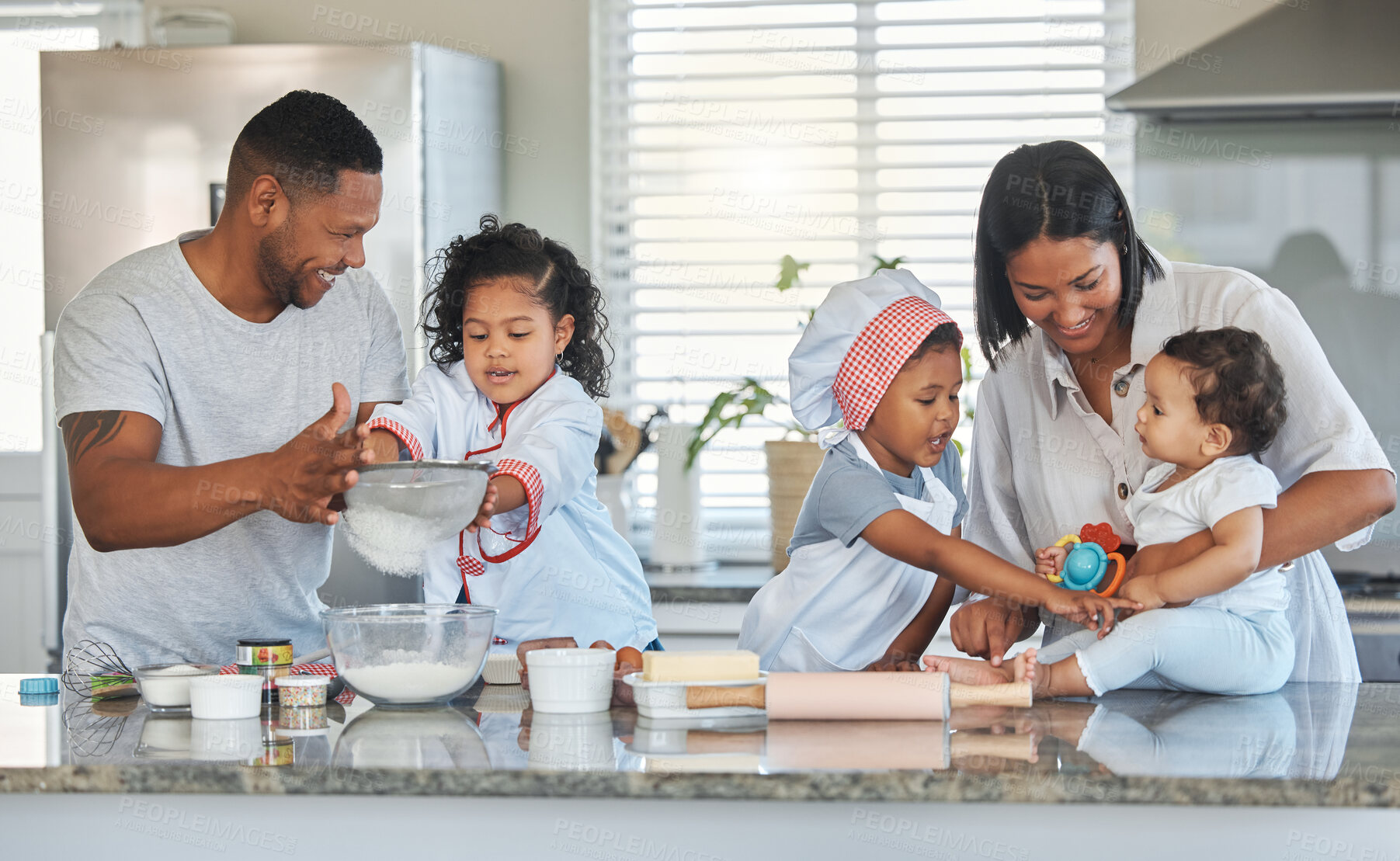 Buy stock photo Happy family, parents and help children with baking, teaching and laugh together. Kids, mother and father with flour sieve for learning cooking, dessert preparation or people bonding in home kitchen