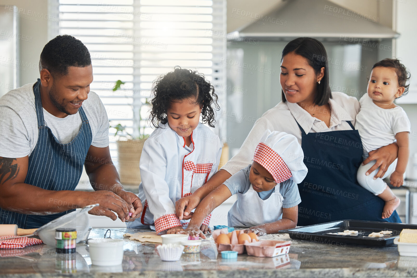 Buy stock photo Happy family, children and dough cutter for baking, teaching and shape flour in home kitchen. Mother, father and kids learning cooking to help with dessert, recipe and people prepare cookies together