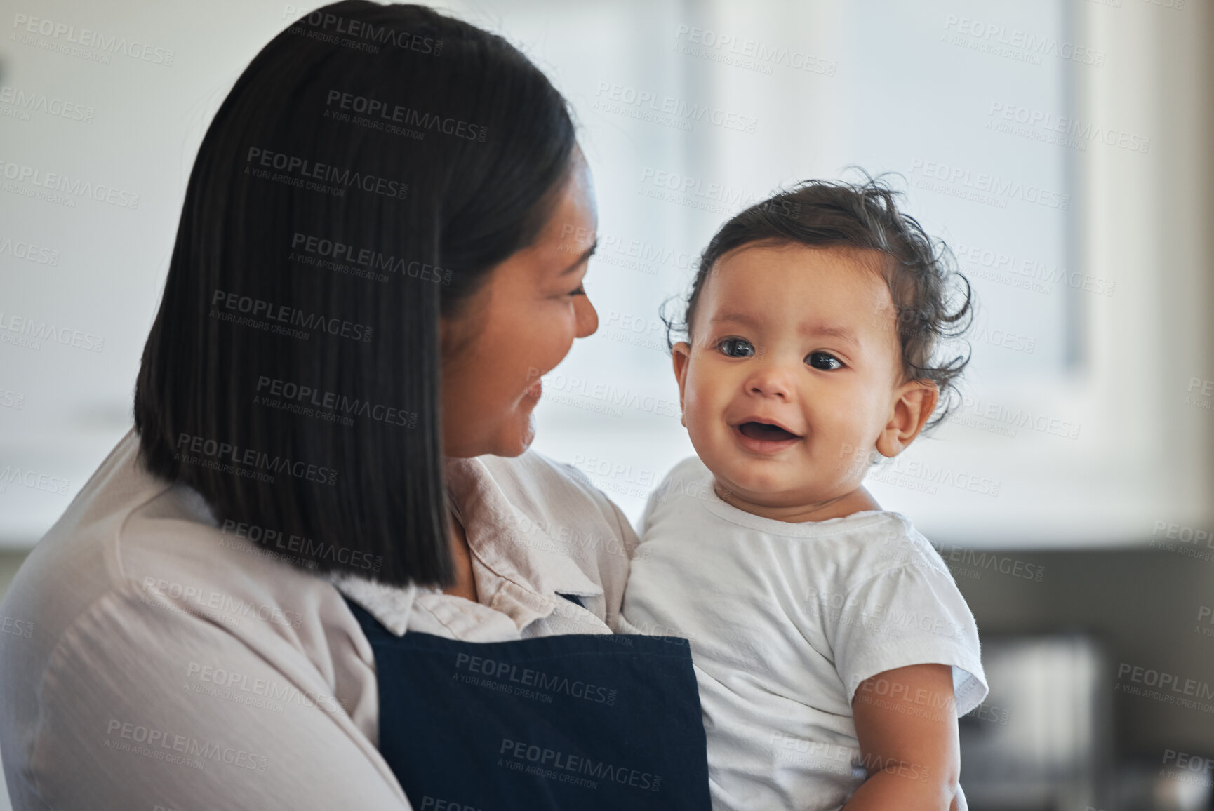 Buy stock photo Bonding, child and mom in kitchen, family and smile for daughter, love and meal prep for breakfast. Morning, single parent and happy with baby, chef and woman with apron, care and together in house