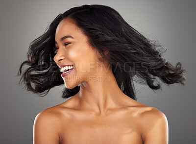 Buy stock photo Cropped shot of an attractive young woman posing in studio against a grey background