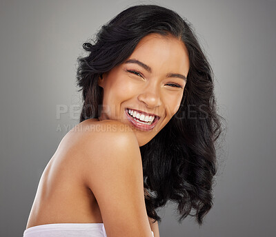 Buy stock photo Laugh, hair and portrait of woman in studio for confidence, healthy texture and growth. Salon, hairdresser and isolated person with smile for beauty, spa wellness and cosmetics on gray background