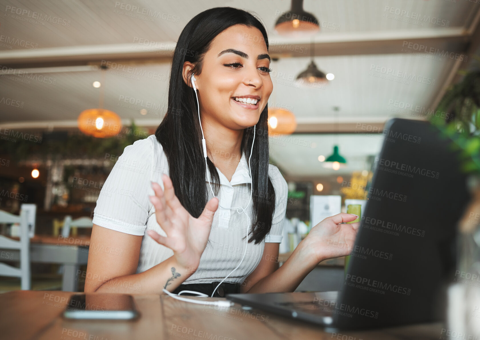 Buy stock photo Shot of a beautiful young businesswoman hosting s video call in a cafe