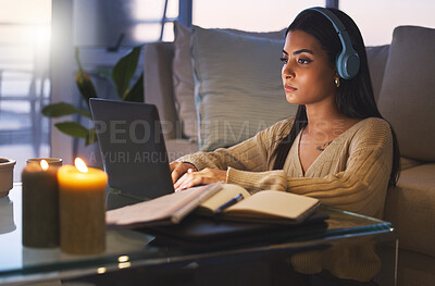 Buy stock photo Laptop, online course and woman on sofa with headphones, books and virtual university project at night. Elearning education, research and college student with computer, webinar and studying at home