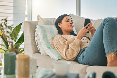 Buy stock photo Woman, relax and phone on sofa at house with communication, social media and reading online ebook. Girl, rest and mobile with texting contact, review email and morning news of networking notification