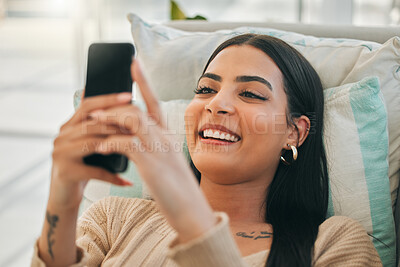 Buy stock photo Happy, meme and woman with phone on sofa for social media, online chatting and funny website. Relax, home and girl on smartphone for communication, networking and internet in living room on weekend