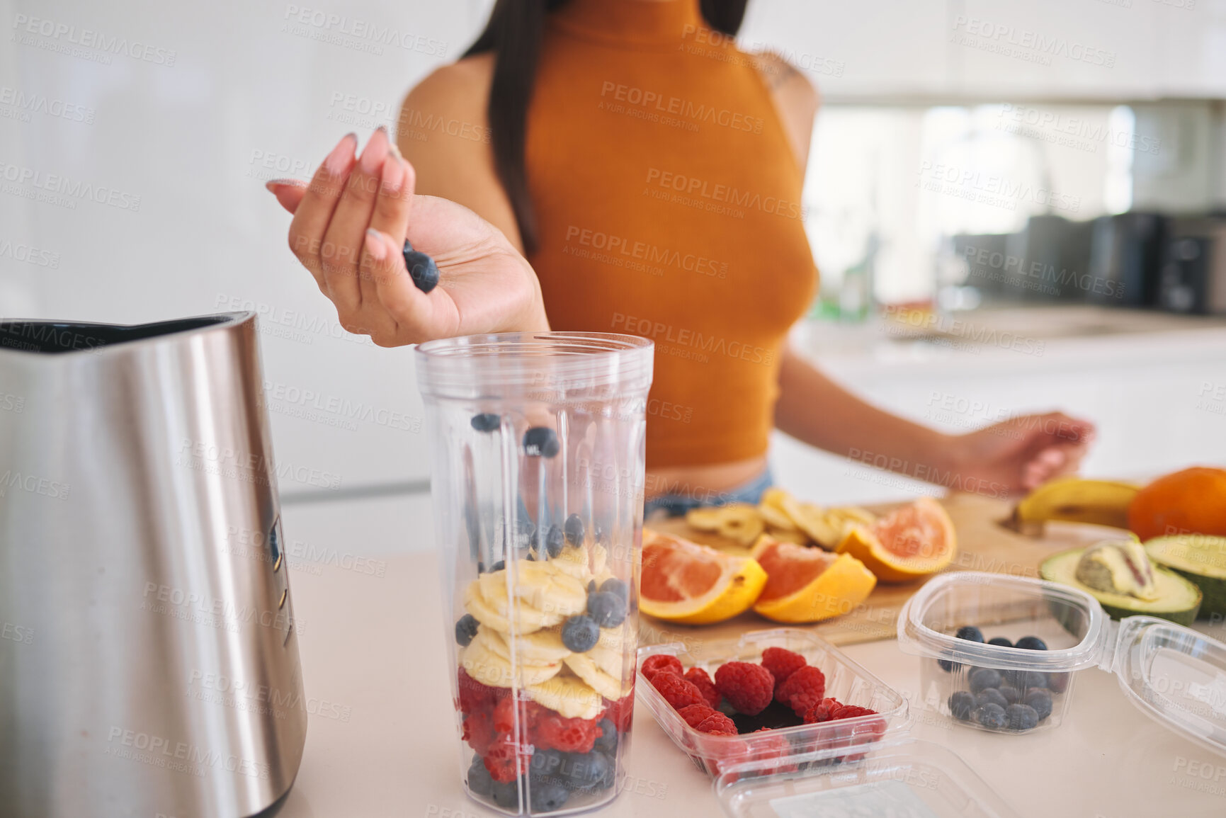 Buy stock photo Fruit, smoothie and detox with hands of woman in kitchen for gut health, diet and breakfast. Wellness, blender and nutrition with closeup of female person at home for cooking, juice and weight loss