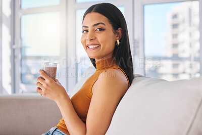 Buy stock photo Woman, portrait and drinking smoothie in home, healthy milkshake and calories in beverage. Female person, weight loss cocktail and vegetarian diet for nutrition, organic detox and protein on couch