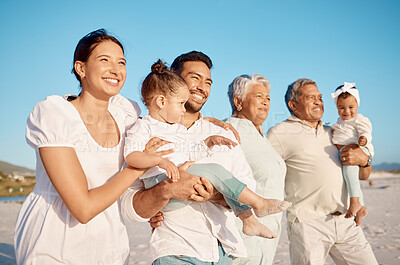 Buy stock photo Shot of a multi-generational family spending time together at the beach