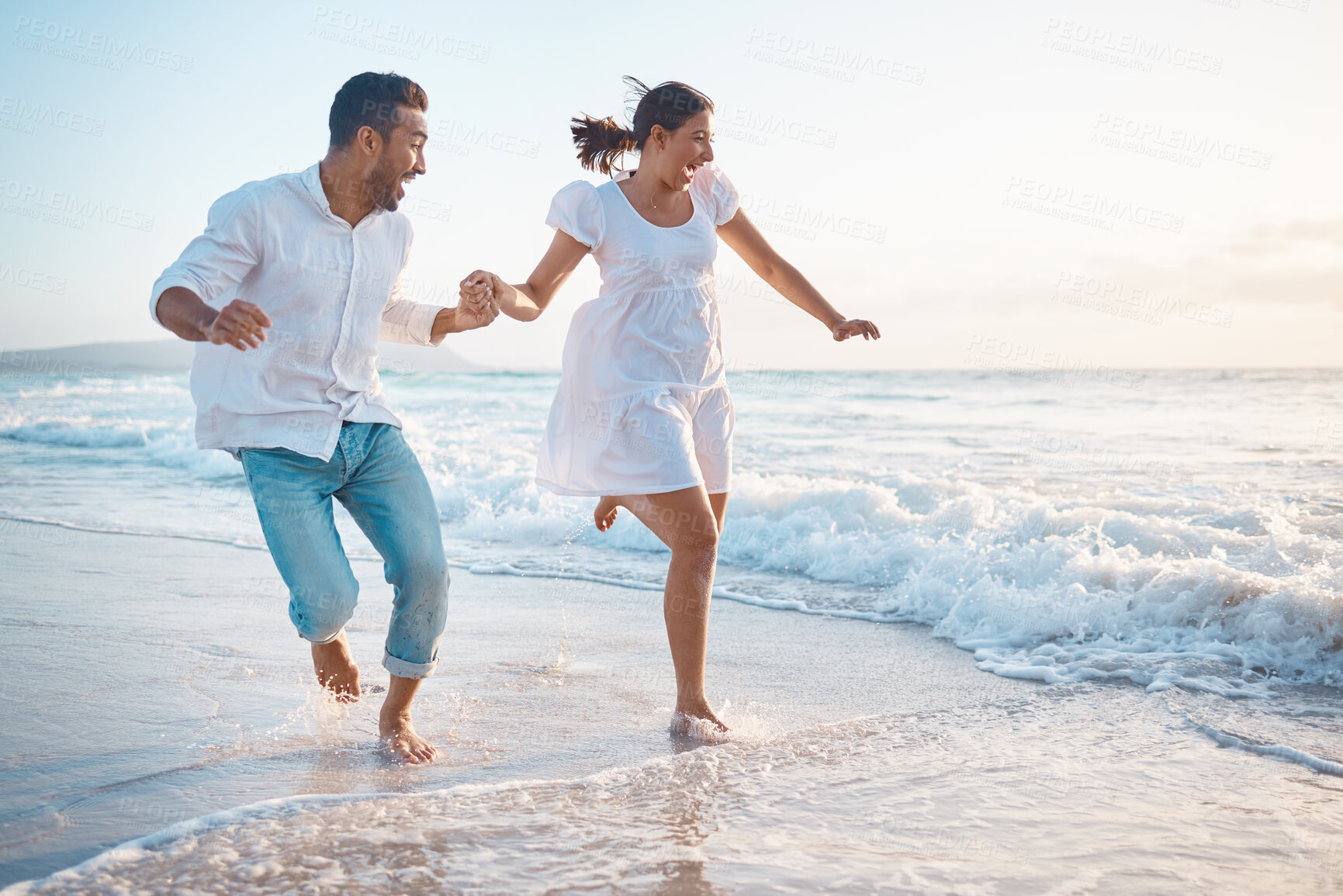 Buy stock photo Couple, running and holding hands at beach, laughing and outdoor with adventure, love and bonding in summer. People, man and woman with connection, care and happy on holiday by ocean in Indonesia