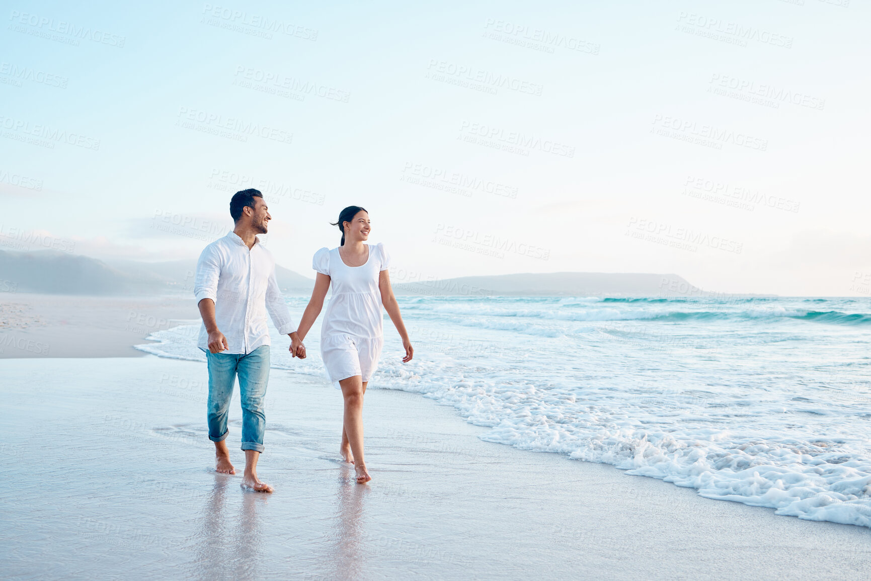 Buy stock photo Couple, walking and holding hands on vacation, beach and outdoor with loyalty, love and bonding in summer. People, man and woman with mock up space, care and trust on holiday by ocean in Indonesia