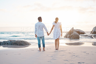 Buy stock photo Shot of a young couple spending time together at the beach