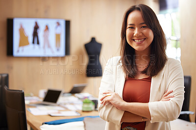 Buy stock photo Shot of a young businesswoman standing with her arms crossed in an office at work