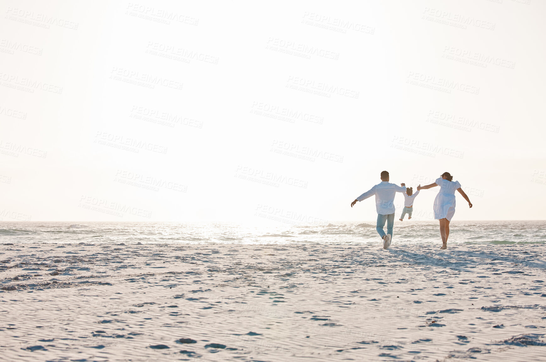 Buy stock photo Family, holding hands and playing on beach with mockup space for holiday weekend or vacation. Mother, father and child enjoying quality play time together for fun bonding or travel in nature outdoors