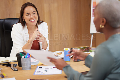 Buy stock photo Shot of two businesswoman having a meeting in an office at work