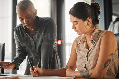 Buy stock photo Shot of two female designers working in an office