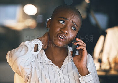 Buy stock photo Shot of a young businesswoman suffering from neck pain while on a call at night in a modern office