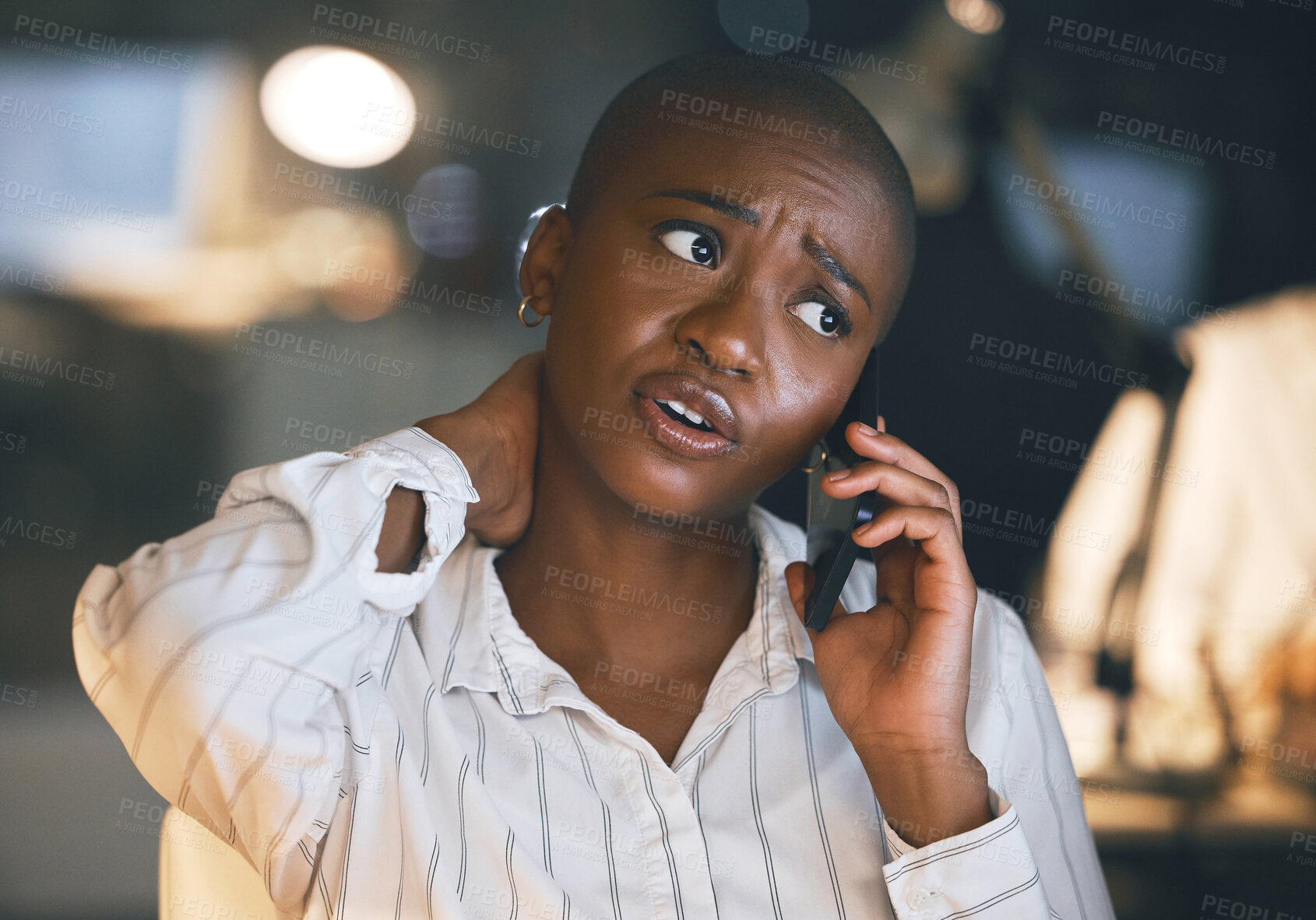 Buy stock photo Neck pain, phone call and woman in office, talking and working late with injury, night and communication. Dark, hurt and black person with mobile, journalist and fact checking for story and sore