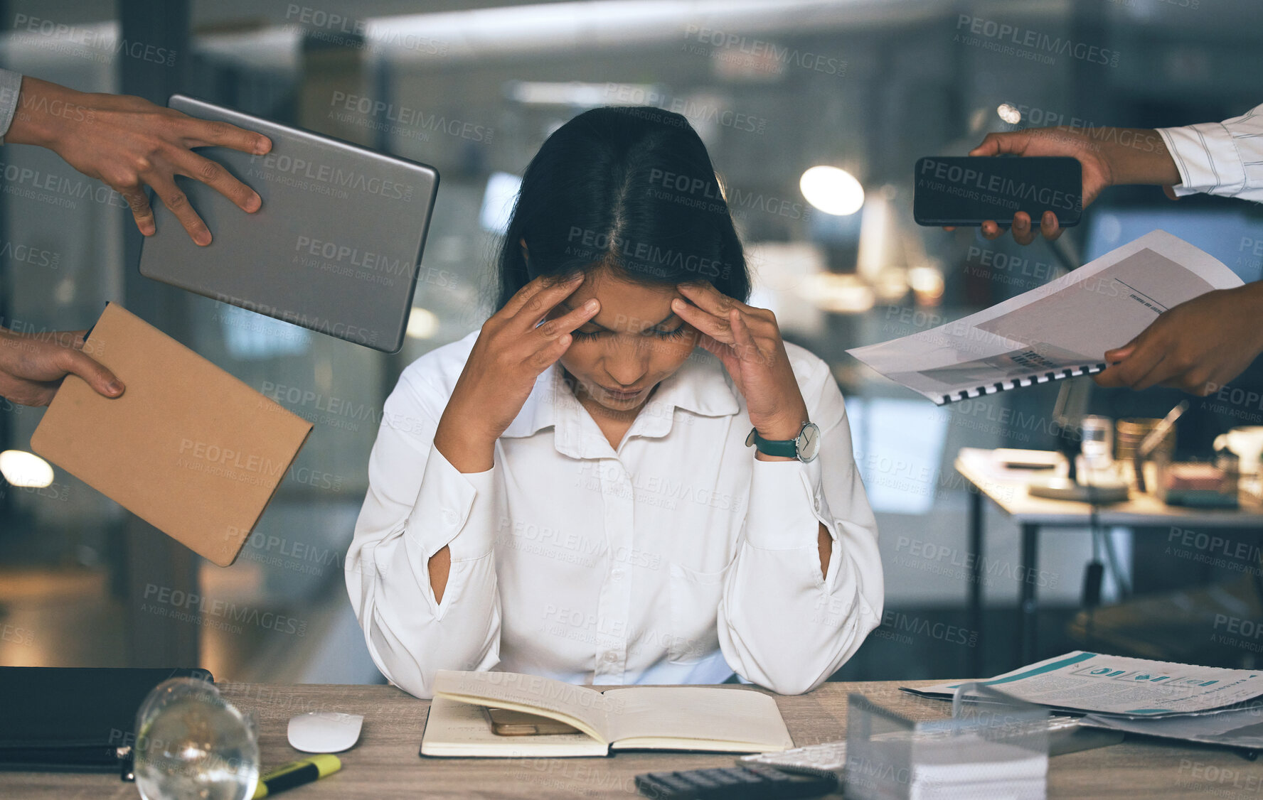 Buy stock photo Shot of a young businesswoman suffering from a headache in a demanding work environment