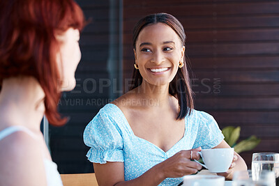 Buy stock photo Shot of two young female friends catching up at a cafe