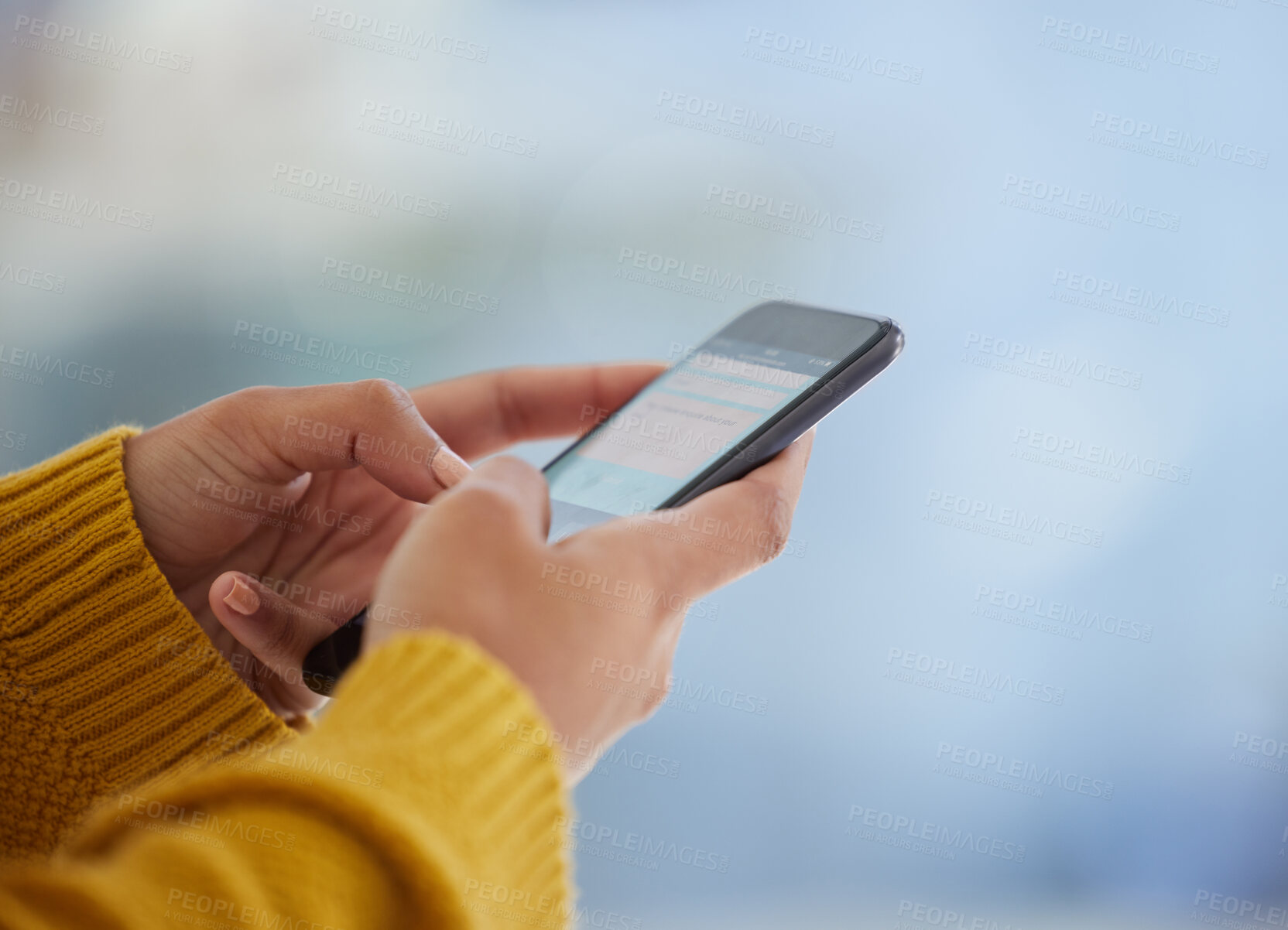 Buy stock photo Shot of an unrecognizable person using a phone at home